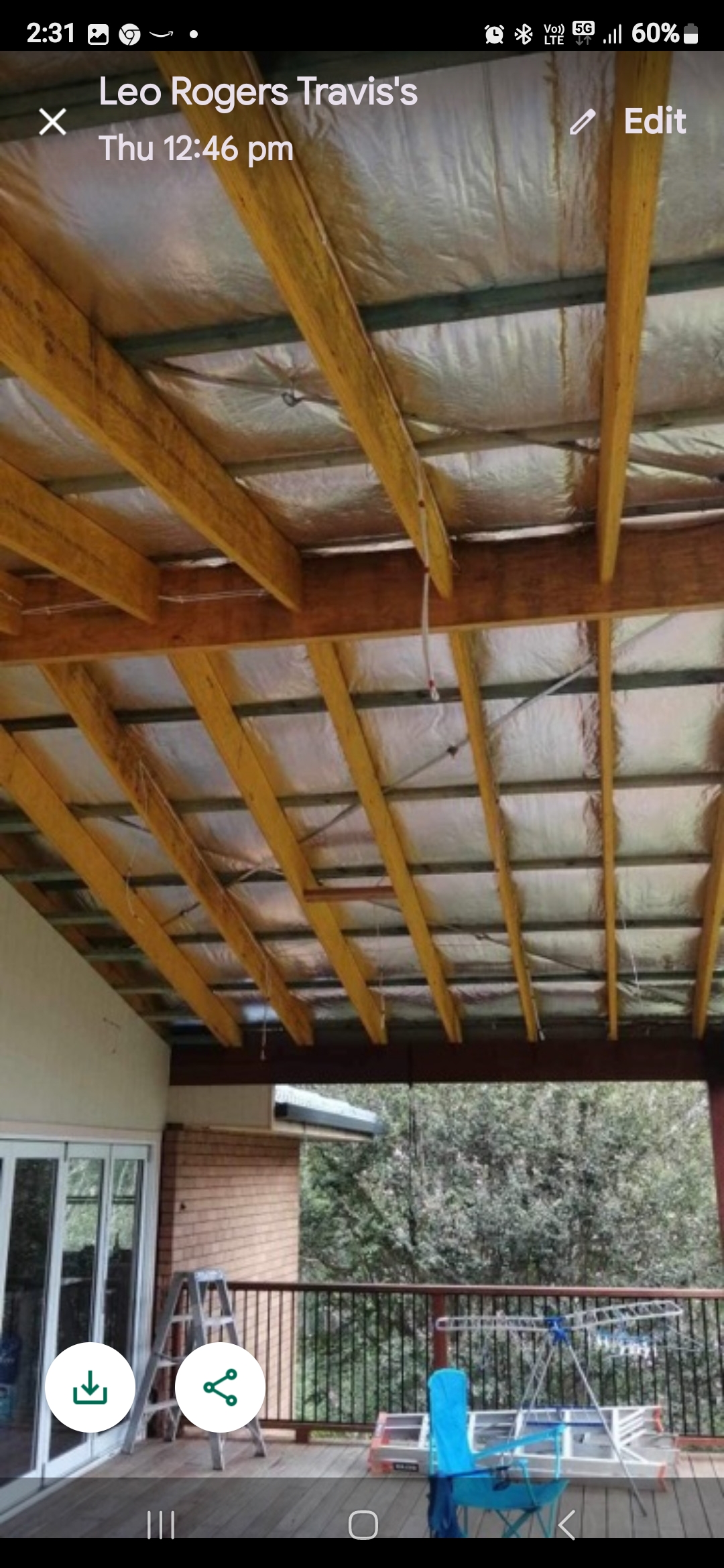 Before — exposed timber rafters and foil insulation in alfresco