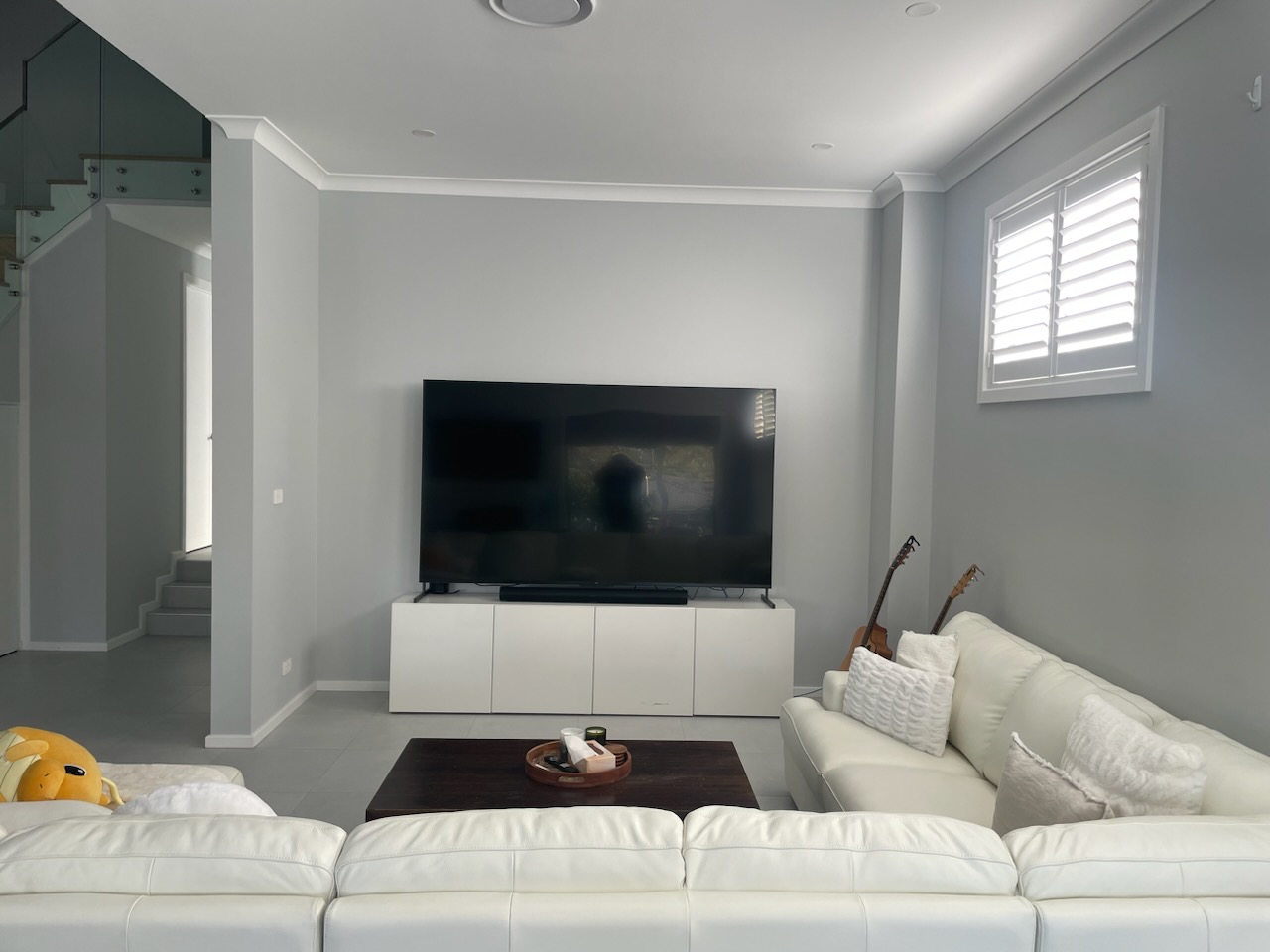 Stage 3 — room plastered and finished, smooth grey walls